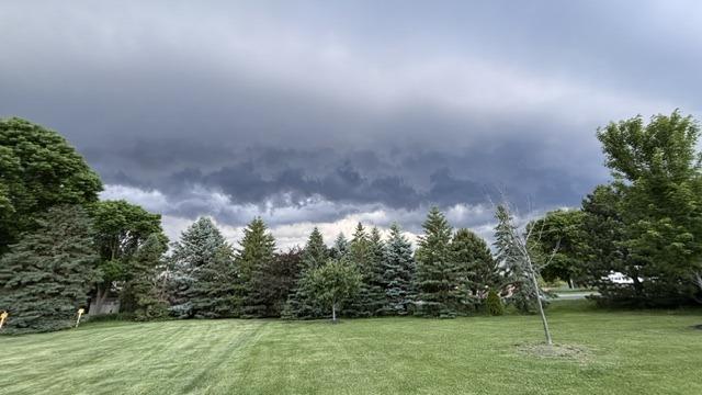 Fresh Cut Lawn Under Storm Clouds, landscaping in Waconia, MN